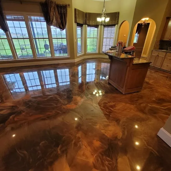 Marbled metallic epoxy floor with flowing reflective pigment in a Palm Beach County interior