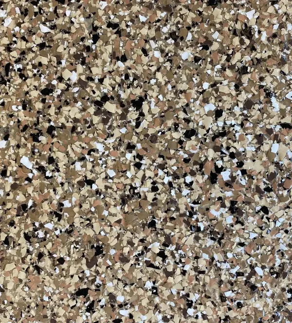 Tan and black flake epoxy floor close-up