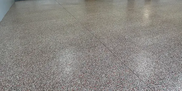 Metal shop building red flake epoxy floor